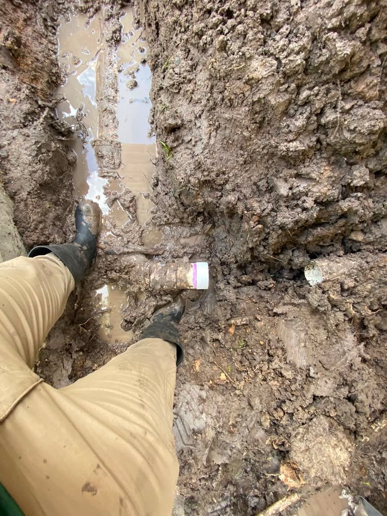 Yard drainage and irrigation installation at a residential property